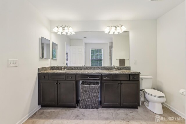 106 Ellsworth Way S, Brunswick, NJ 08852 - bathroom with toilet, baseboards, a chandelier, double vanity, and a shower with shower door