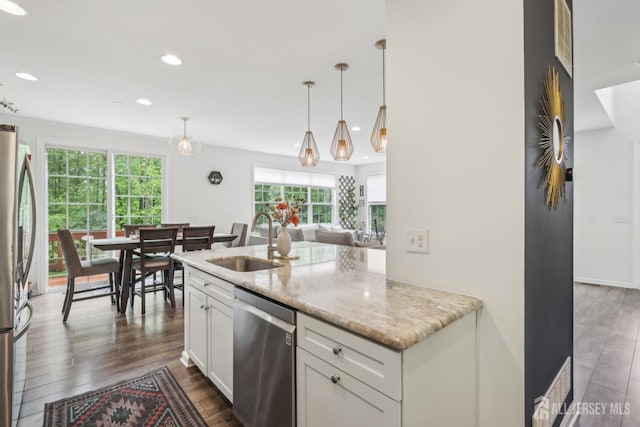 106 Ellsworth Way S, Brunswick, NJ 08852 - kitchen with stainless steel appliances, a sink, recessed lighting, dark wood-style flooring, and light stone counters