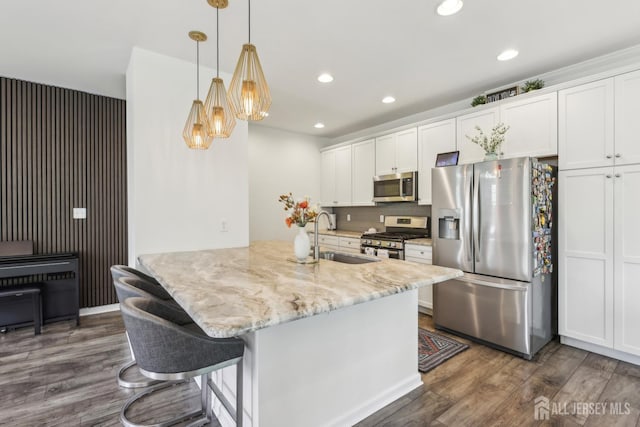 106 Ellsworth Way S, Brunswick, NJ 08852 - kitchen with stainless steel appliances, a sink, dark wood finished floors, white cabinets, and recessed lighting