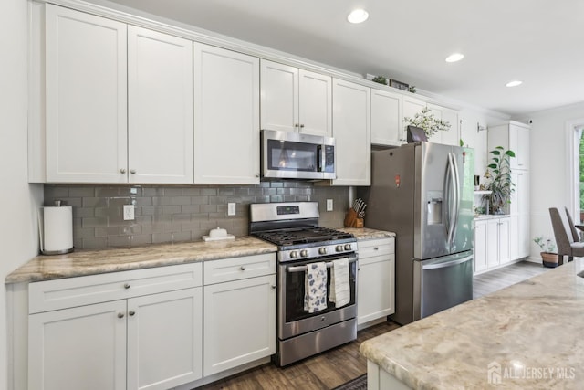 106 Ellsworth Way S, Brunswick, NJ 08852 - kitchen featuring stainless steel appliances, dark wood-style floors, decorative backsplash, white cabinetry, and recessed lighting