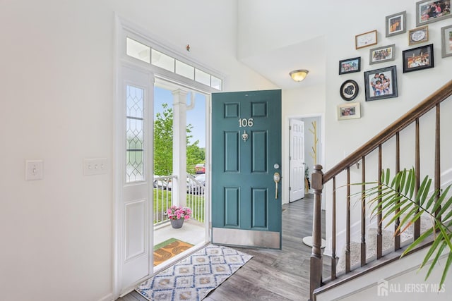 106 Ellsworth Way S, Brunswick, NJ 08852 - entrance foyer with stairs, wood finished floors, baseboards, and a towering ceiling