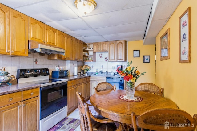 99 William St, South River, NJ 08882 - kitchen with electric range oven, under cabinet range hood, dishwasher, a paneled ceiling, and tasteful backsplash