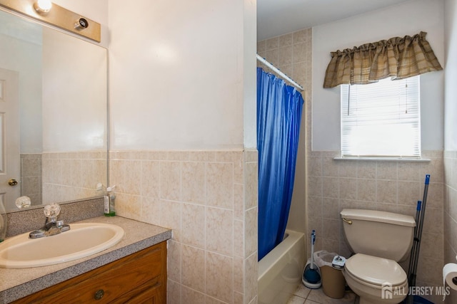 99 William St, South River, NJ 08882 - bathroom with tile walls, vanity, shower / bathtub combination with curtain, and wainscoting