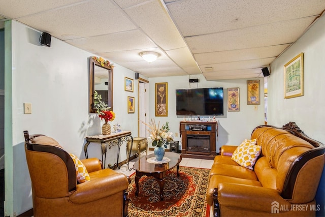 99 William St, South River, NJ 08882 - tiled living room with a drop ceiling and a glass covered fireplace