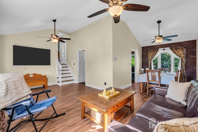 73 Webb Dr, Fords, NJ 08863 - living room with a ceiling fan, wood finished floors, high vaulted ceiling, and stairway