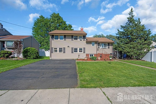 73 Webb Dr, Fords, NJ 08863 - view of front of house with a chimney and driveway