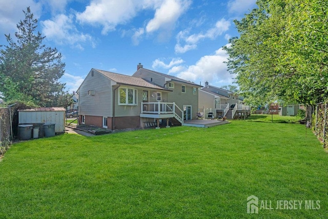 73 Webb Dr, Fords, NJ 08863 - back of property with a storage shed and a deck