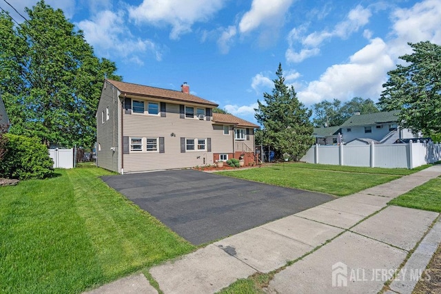 73 Webb Dr, Fords, NJ 08863 - view of front of property with a chimney and driveway