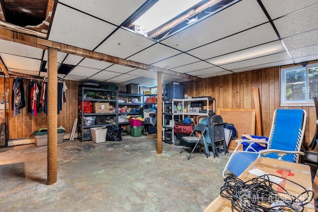 73 Webb Dr, Fords, NJ 08863 - basement with a drop ceiling, wood walls, and a baseboard heating unit