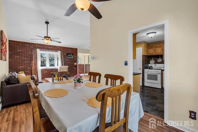 73 Webb Dr, Fords, NJ 08863 - dining room with ceiling fan, brick wall, and light wood-type flooring