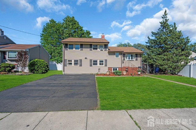 73 Webb Dr, Fords, NJ 08863 - view of front of home with a chimney and driveway
