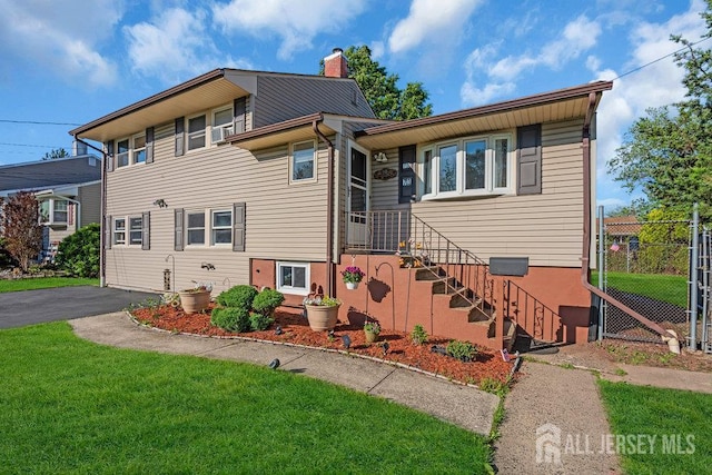 73 Webb Dr, Fords, NJ 08863 - view of front facade featuring a chimney