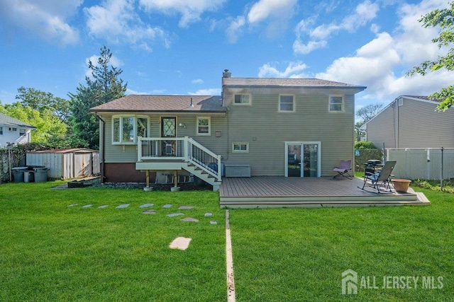 73 Webb Dr, Fords, NJ 08863 - back of house featuring a fenced backyard, a shed, a wooden deck, and a chimney