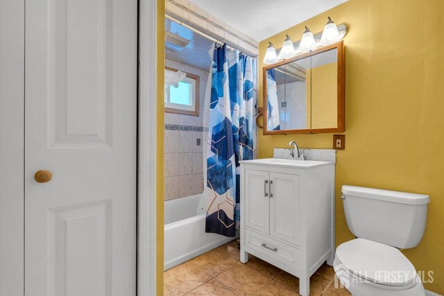 73 Webb Dr, Fords, NJ 08863 - full bathroom featuring vanity, shower / bath combo with shower curtain, and tile patterned flooring