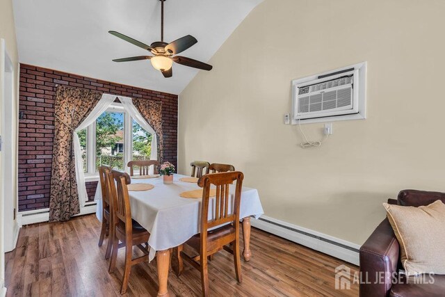 73 Webb Dr, Fords, NJ 08863 - dining area featuring a baseboard heating unit, ceiling fan, wood finished floors, brick wall, and high vaulted ceiling
