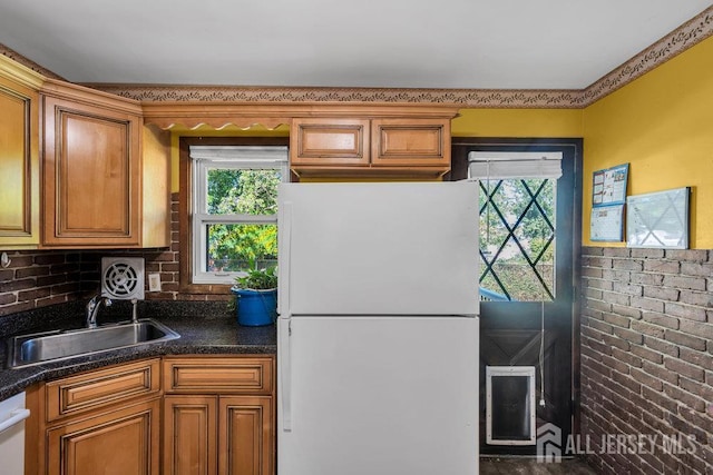 73 Webb Dr, Fords, NJ 08863 - kitchen featuring white appliances, plenty of natural light, and brown cabinets