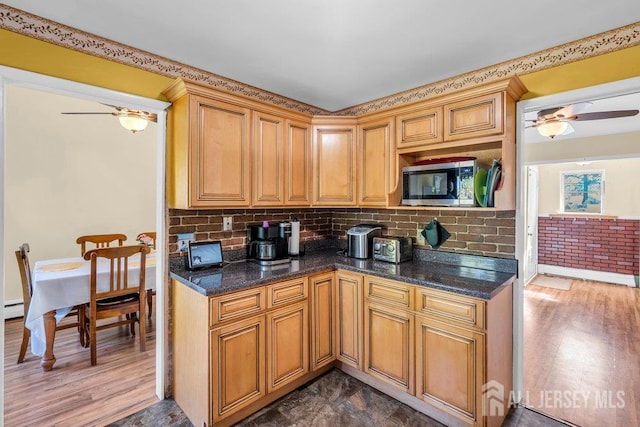 73 Webb Dr, Fords, NJ 08863 - kitchen with stainless steel microwave, ceiling fan, dark wood finished floors, and backsplash