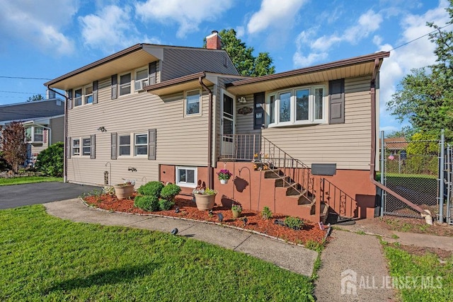 73 Webb Dr, Fords, NJ 08863 - view of front facade with a chimney