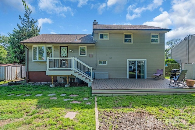 73 Webb Dr, Fords, NJ 08863 - rear view of property with a storage unit, a chimney, and a wooden deck