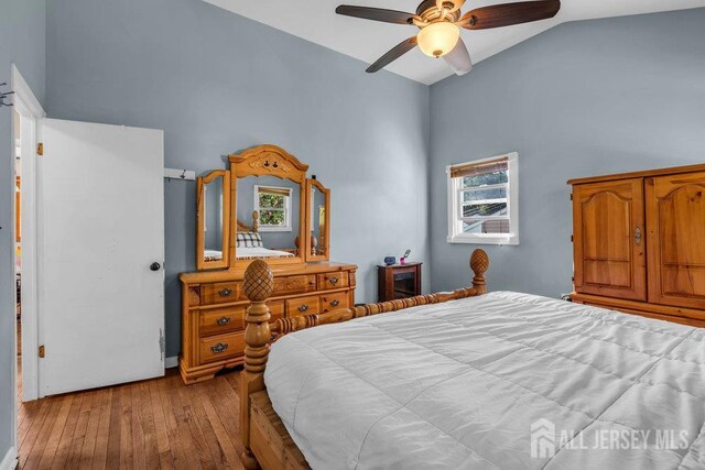 73 Webb Dr, Fords, NJ 08863 - bedroom with hardwood / wood-style flooring, high vaulted ceiling, multiple windows, and a ceiling fan