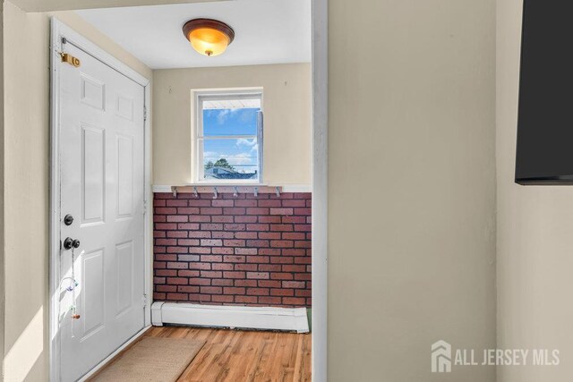 73 Webb Dr, Fords, NJ 08863 - entryway featuring light wood finished floors and wainscoting