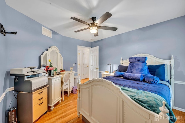 10 Rauer Ct, South Plainfield, NJ 07080 - bedroom with light wood finished floors and ceiling fan