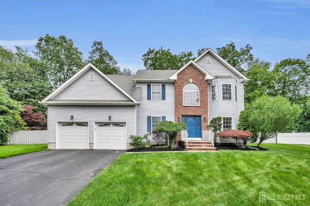 10 Rauer Ct, South Plainfield, NJ 07080 - view of front of house with asphalt driveway and an attached garage