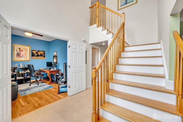 10 Rauer Ct, South Plainfield, NJ 07080 - stairway featuring tile patterned floors and a towering ceiling