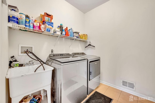 10 Rauer Ct, South Plainfield, NJ 07080 - laundry area with independent washer and dryer and light tile patterned floors