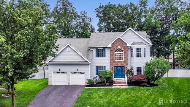 10 Rauer Ct, South Plainfield, NJ 07080 - view of front of house with asphalt driveway, a garage, and a shingled roof