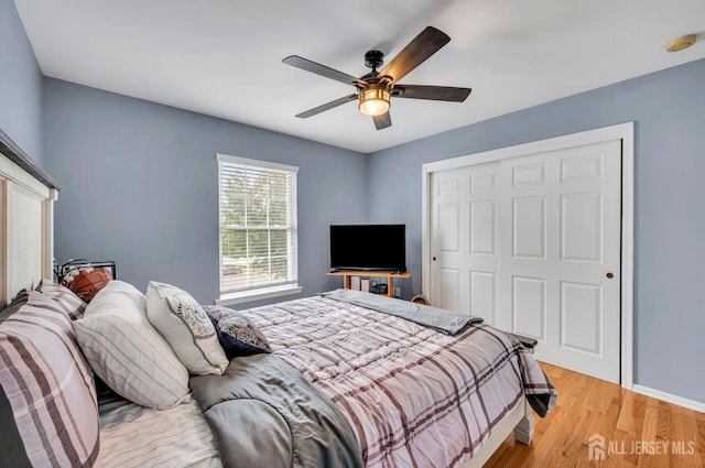 10 Rauer Ct, South Plainfield, NJ 07080 - bedroom with a closet, light wood-style flooring, and ceiling fan