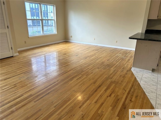 76 Union St Unit A10, Newark, NJ 07105 - unfurnished living room featuring light wood finished floors and baseboards