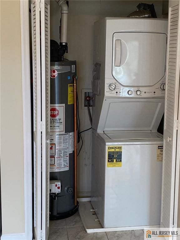 76 Union St Unit A10, Newark, NJ 07105 - laundry area featuring gas water heater and estacked washer and dryer