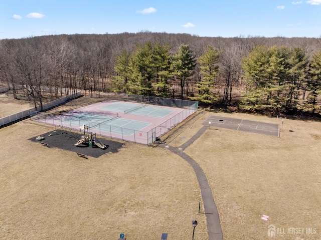 birds eye view of property featuring a view of trees