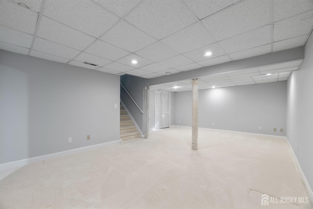 finished basement with recessed lighting, stairway, baseboards, and carpet