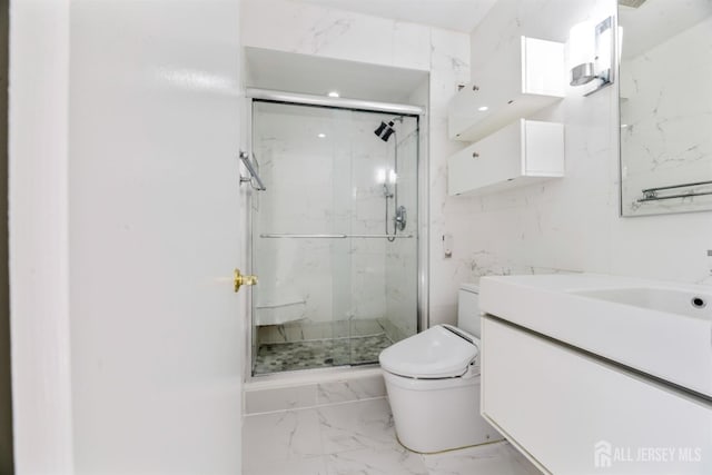 full bathroom featuring a marble finish shower, marble finish floor, toilet, and vanity