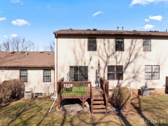 rear view of house featuring a yard, central AC, and a deck