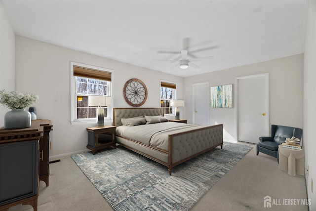 bedroom with baseboards, carpet floors, and ceiling fan