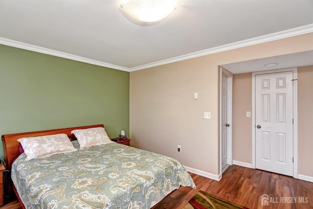 bedroom featuring crown molding and hardwood / wood-style flooring