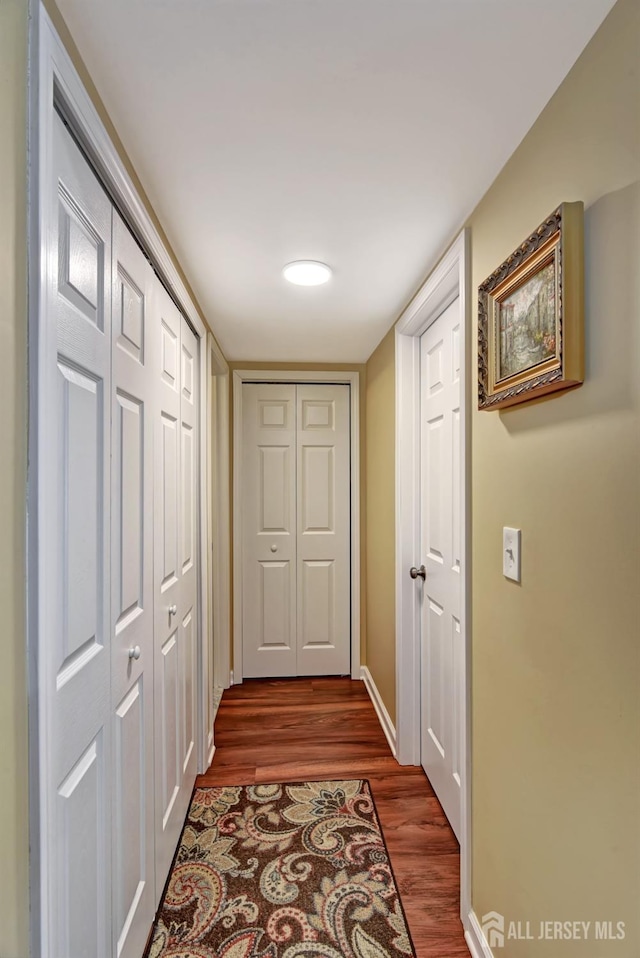 hallway featuring hardwood / wood-style floors