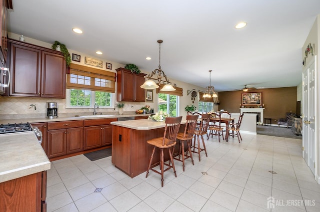 15 Heather Ct, Mansfield, NJ 08022 - kitchen with a sink, light countertops, open floor plan, decorative backsplash, and stainless steel gas range