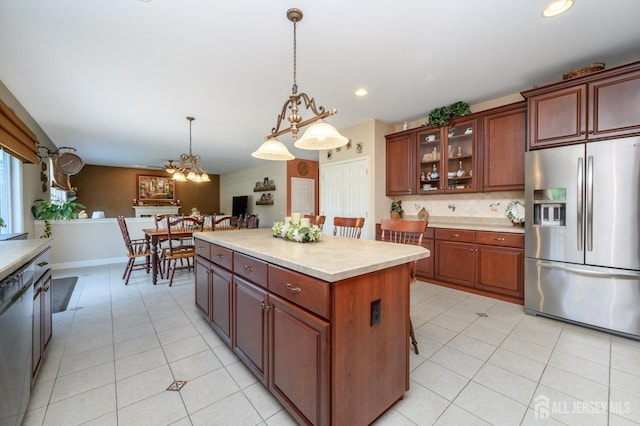 15 Heather Ct, Mansfield, NJ 08022 - kitchen featuring stainless steel fridge, light countertops, light tile patterned floors, hanging light fixtures, and backsplash