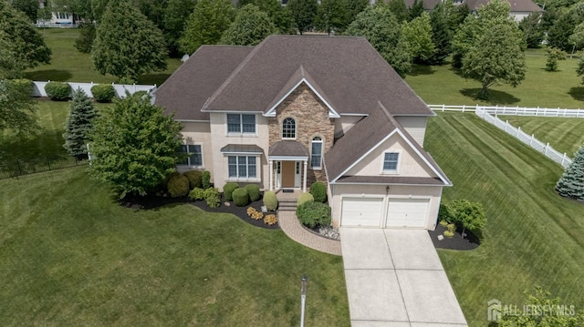 15 Heather Ct, Mansfield, NJ 08022 - traditional-style home featuring stone siding, driveway, roof with shingles, and stucco siding