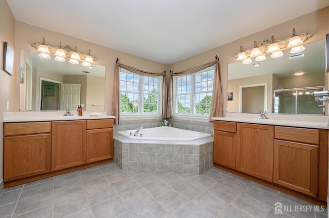 15 Heather Ct, Mansfield, NJ 08022 - full bathroom with two vanities, tile patterned floors, a garden tub, and a stall shower