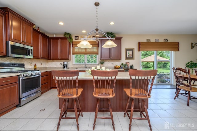 15 Heather Ct, Mansfield, NJ 08022 - kitchen featuring stainless steel appliances, light countertops, a kitchen island, tasteful backsplash, and recessed lighting