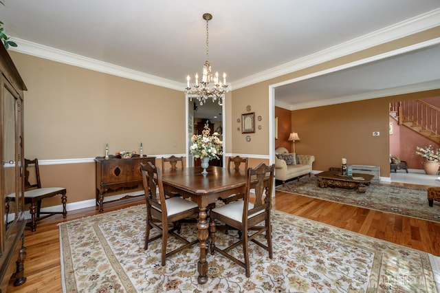 15 Heather Ct, Mansfield, NJ 08022 - dining space with ornamental molding, wood finished floors, stairway, a chandelier, and baseboards