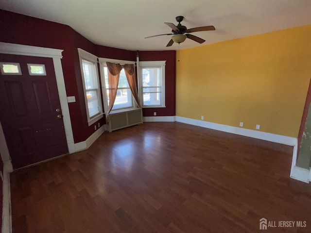 134 S Stevens Ave S, South Amboy, NJ 08879 - foyer with radiator, wood finished floors, a ceiling fan, and baseboards