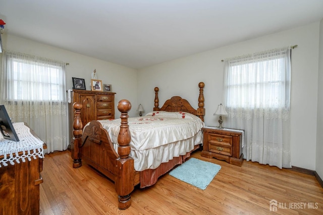 bedroom with light hardwood / wood-style flooring