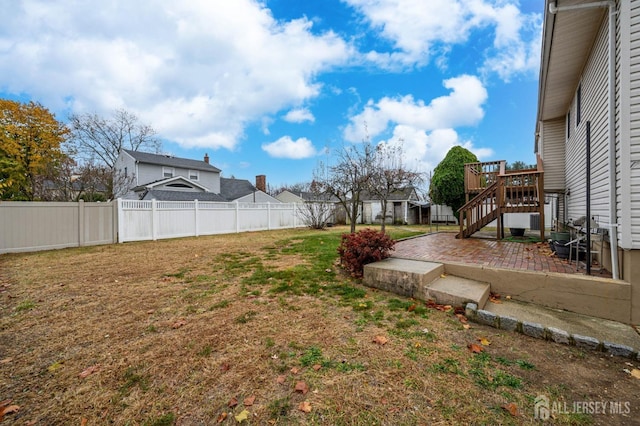 view of yard with a patio area and a deck