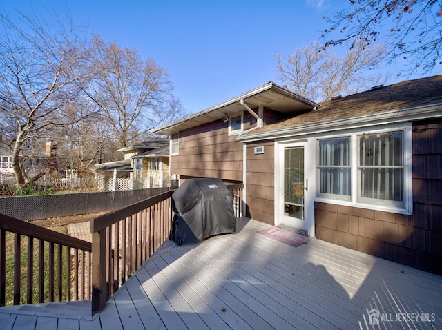 wooden deck featuring area for grilling